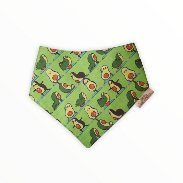 Reversible dog bandana with Mexican food (tacos, chiles, peppers) on one side and an avocado doing yoga on the other side. 