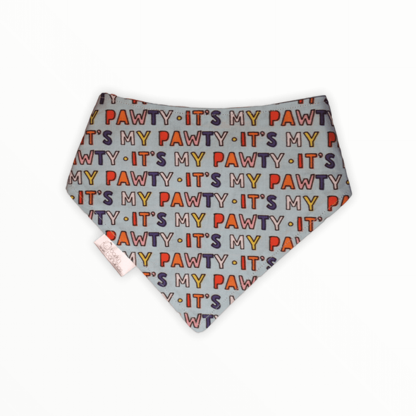 Reversible dog bandana with "It's My Pawty" on one side and a mixtape (cassette tape) on the other side