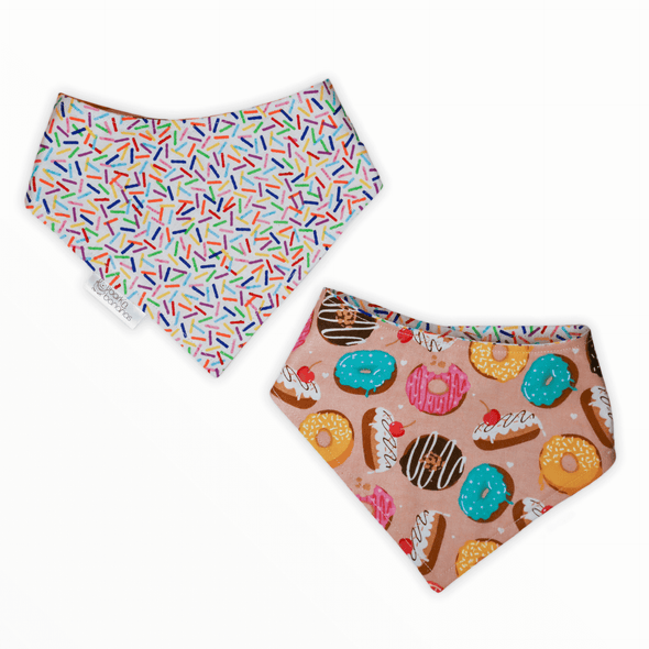 Reversible dog bandana with dessert (donuts and cake) on one side and sprinkles on the other side