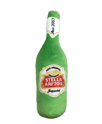Stuffed dog toy in the shape of a Stella Beer Bottle