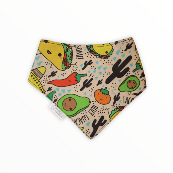 Reversible dog bandana with Mexican food (tacos, chiles, peppers) on one side and an avocado doing yoga on the other side. 